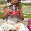 Young girl drinking juice