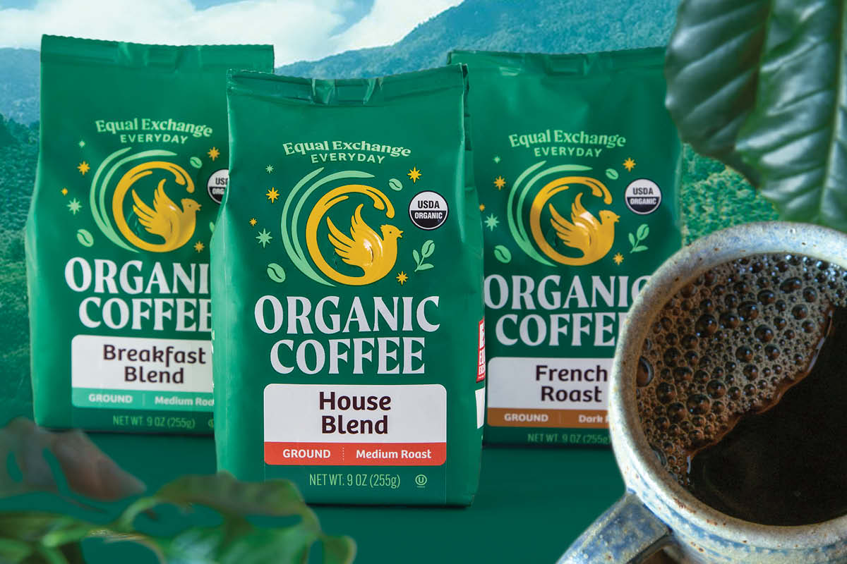 Three bags of Equal Exchange coffee and a mug of hot coffee