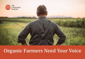 An image with a farmer and the text "organic farmers need your voice"